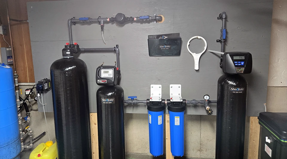 Compact Deluxe side-by-side water filter and softener unit installed in a Port Stanley Ontario residence